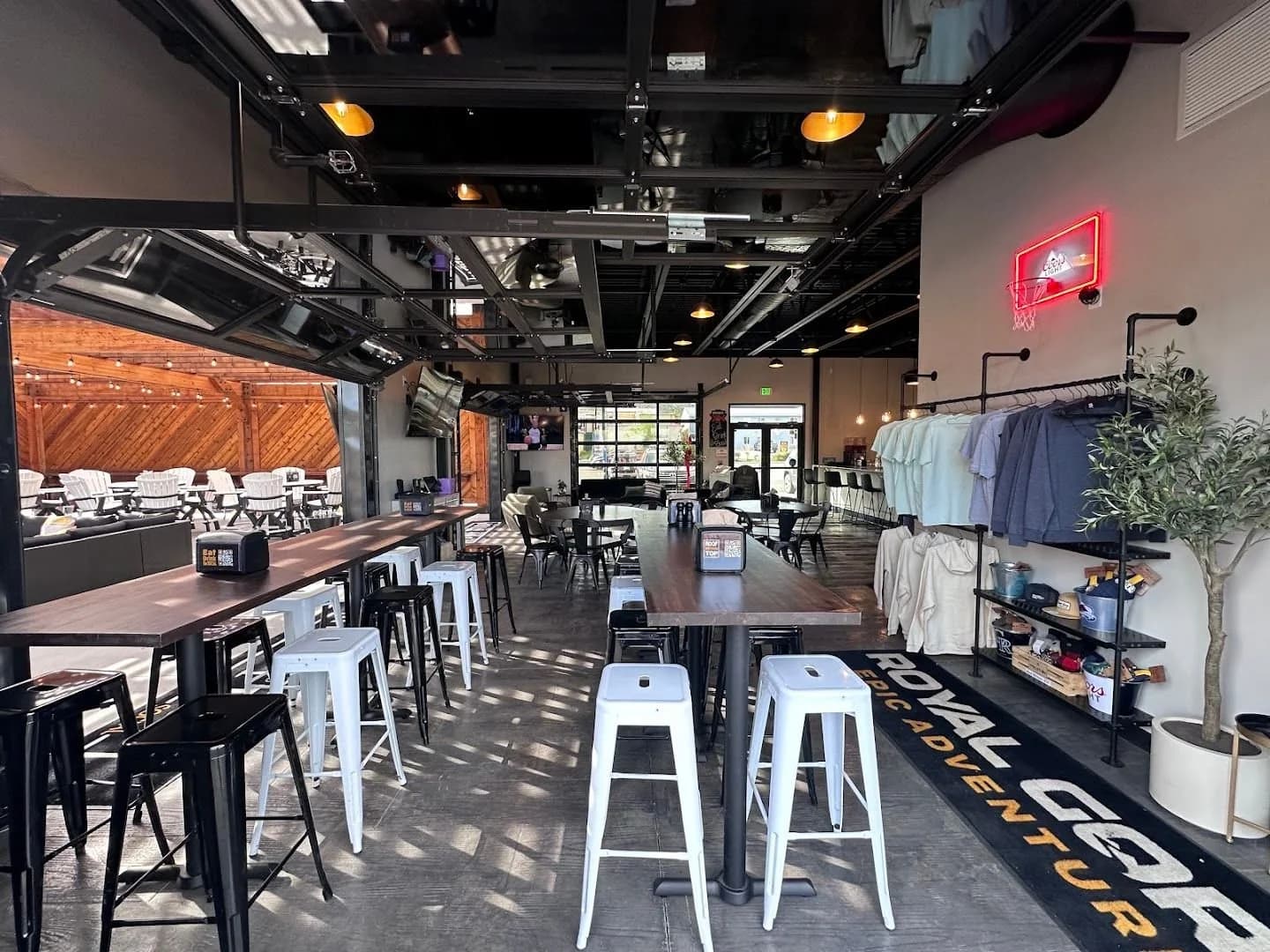 Interior bar with garage doors and lounge seating